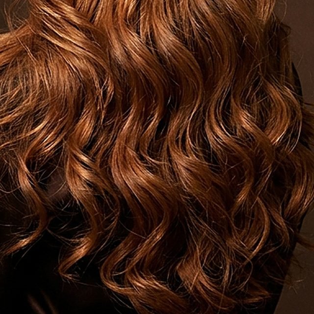 Waves of the Wings wig in copper red, close up